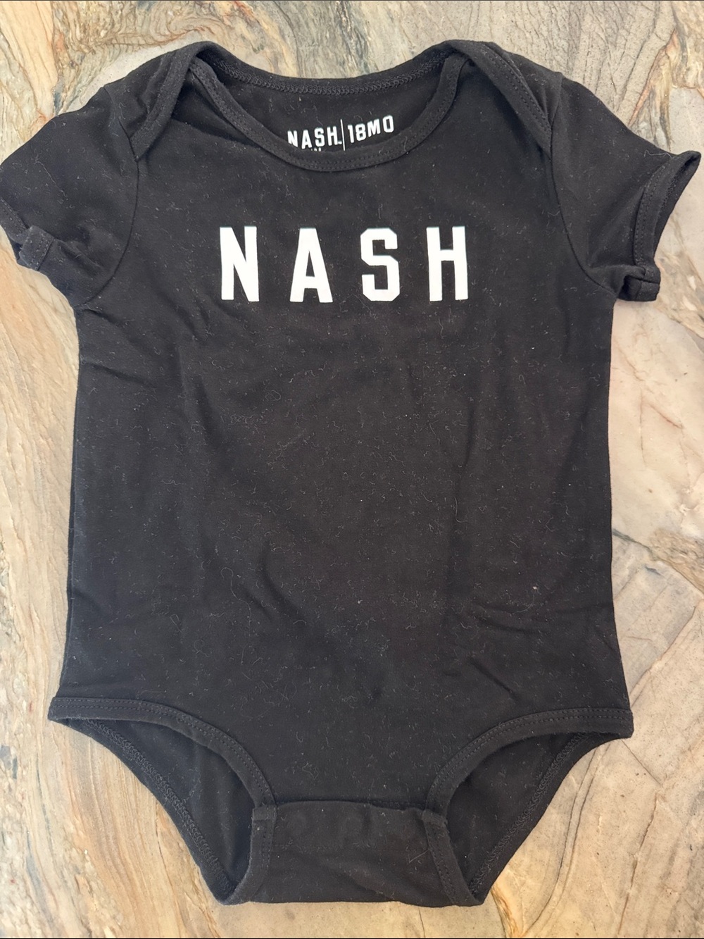 Ash Black Baby One-Piece Bodysuit with White 'NASH' Logo